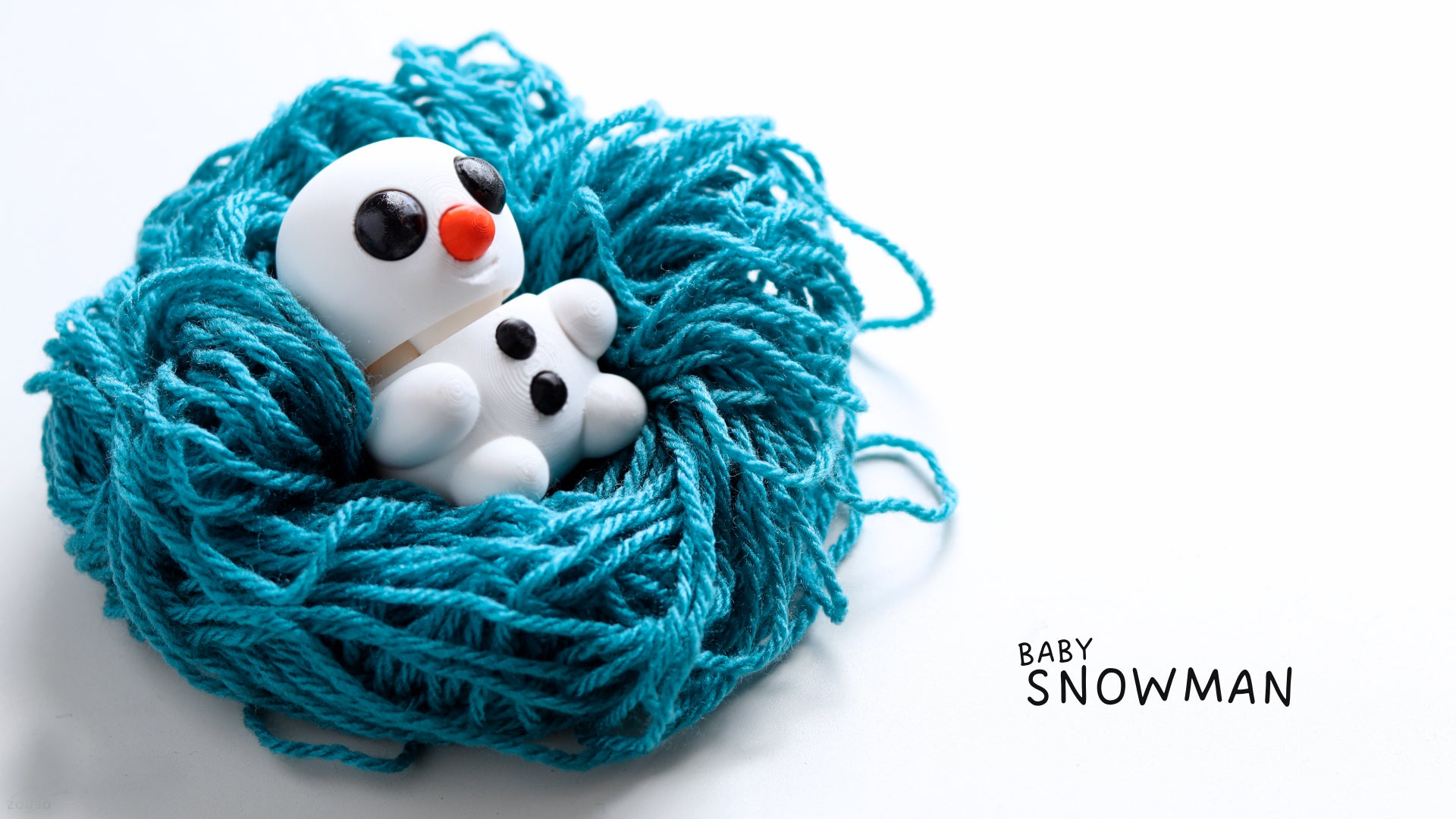 a close up of a ball of yarn with a snowman on it