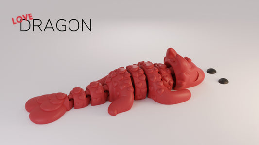 a red dragon is laying on a white surface