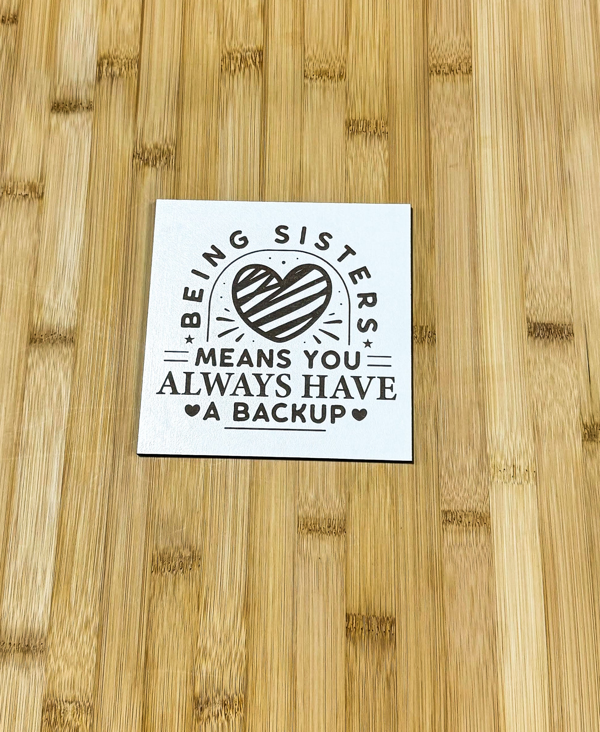 a sticker on a wooden table that says being sister means you always have a