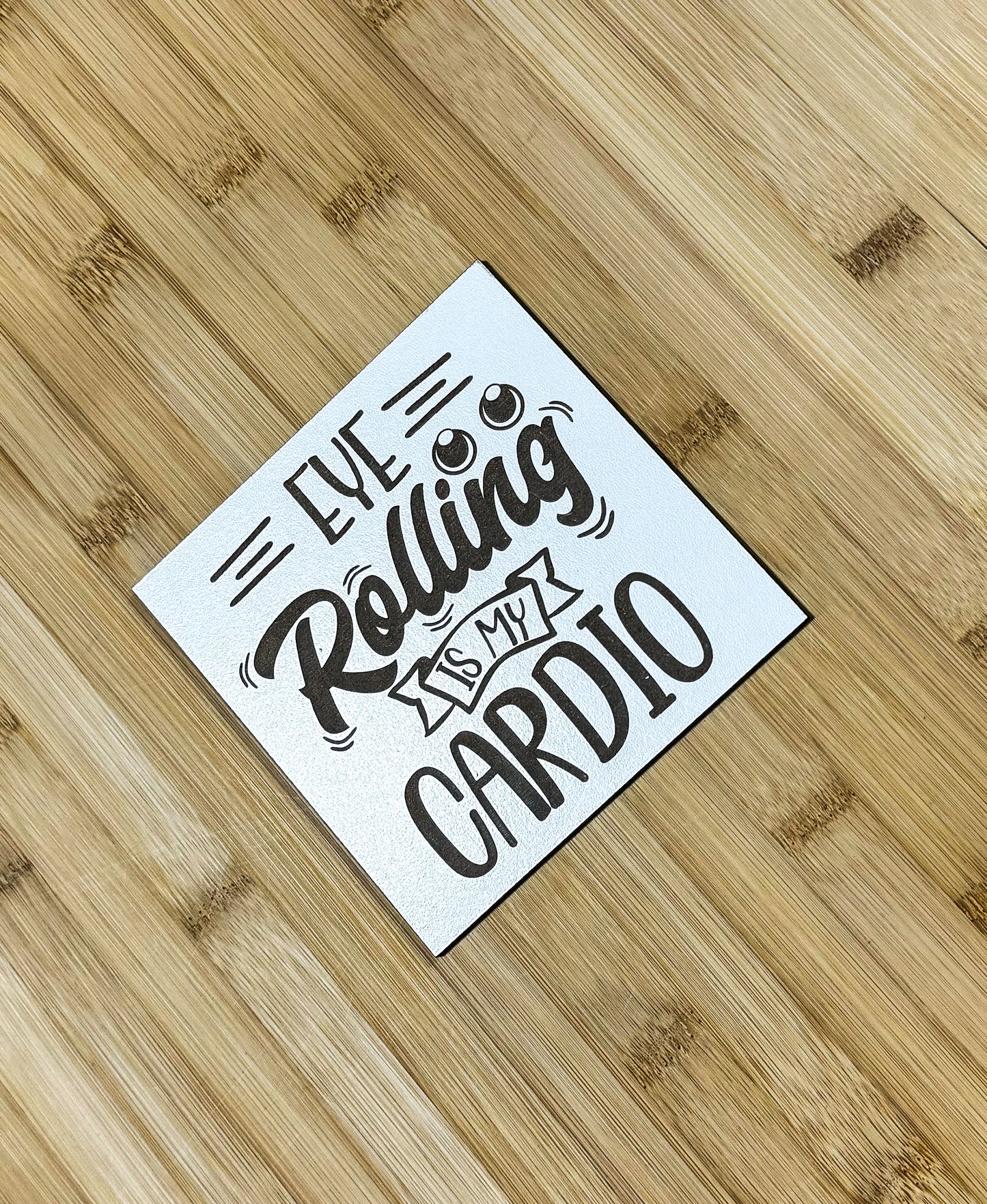 a sticker that says we are rolling my cardio on a wooden surface