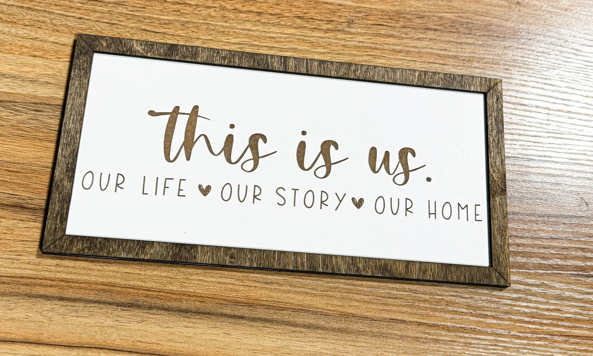 a sign that says, this is us our life story our home