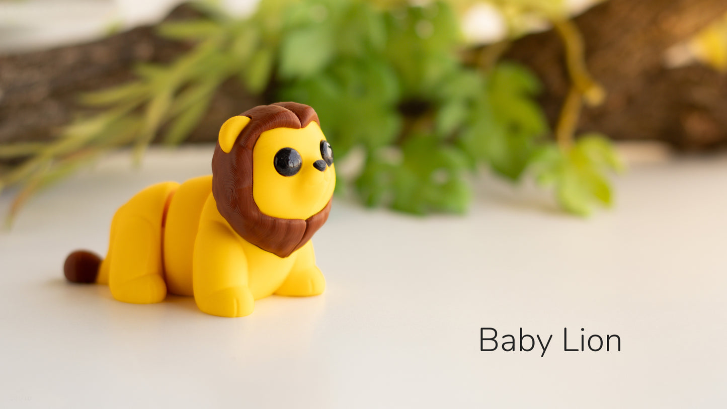 a toy lion sitting on top of a white table