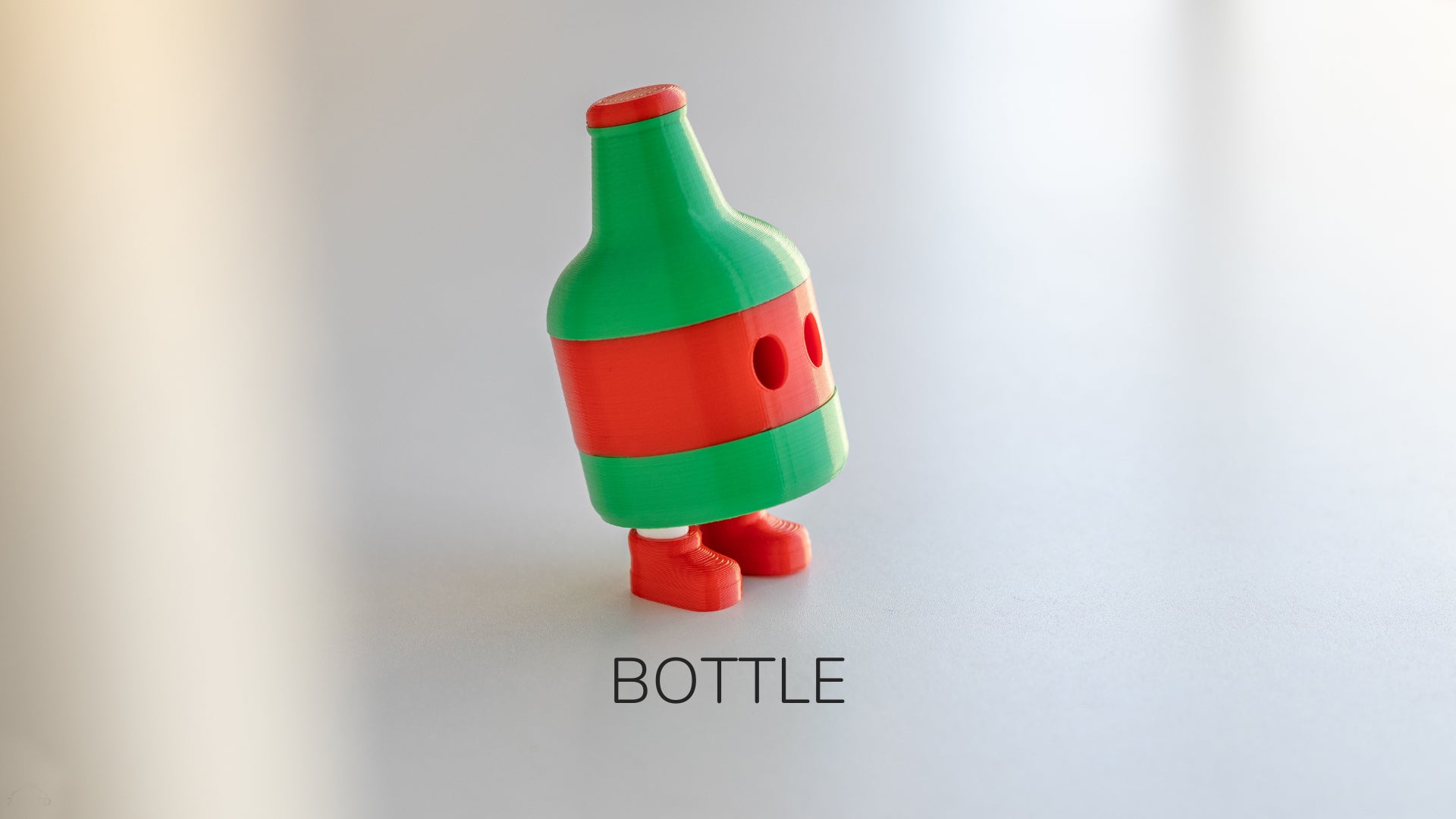 a green bottle with a red cap on it