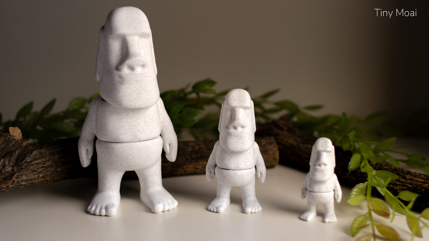 a group of small white sculptures sitting on top of a table