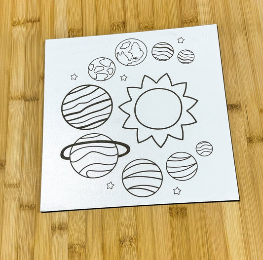 a piece of paper with a picture of planets on it