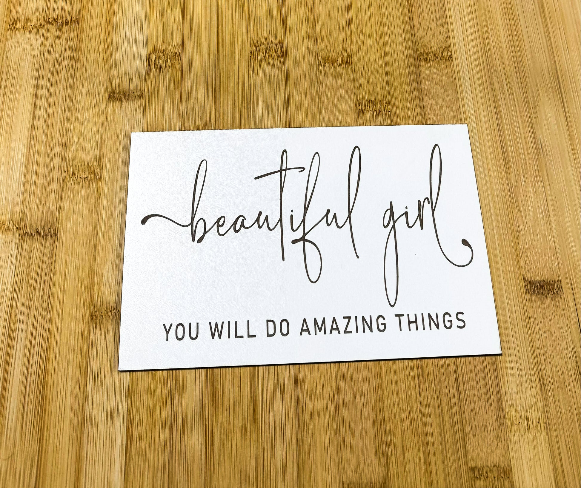 a piece of paper that says, beautiful girl you will do amazing things