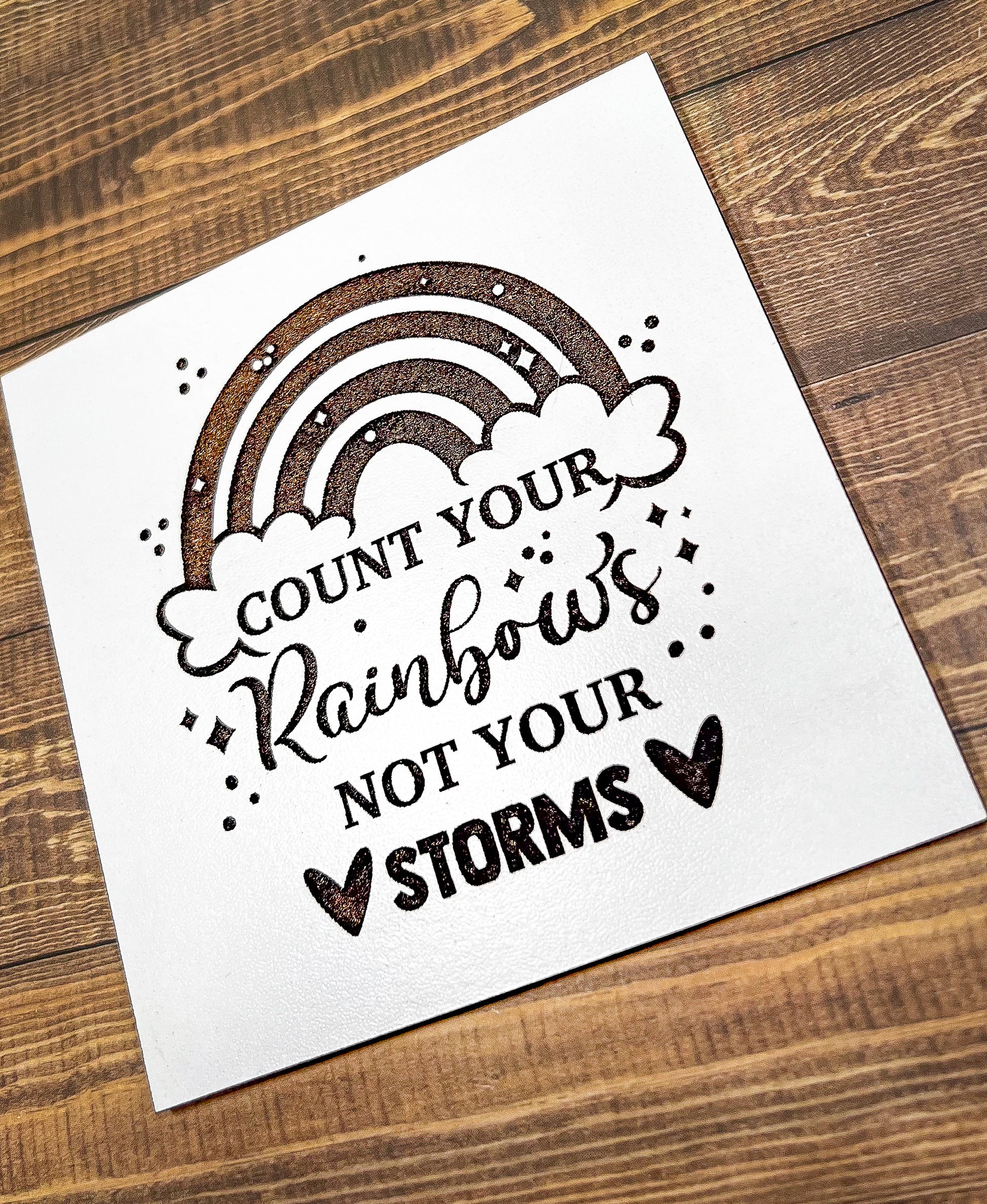 a card that says count your rainbows not your storm