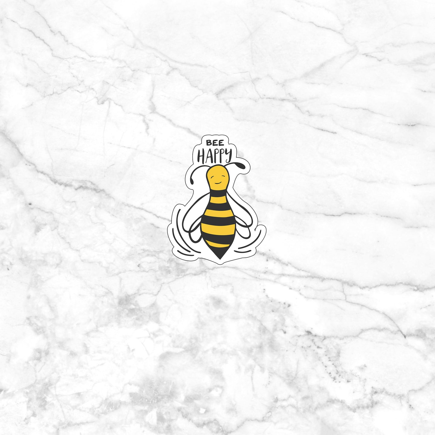 a sticker of a bee on a marble surface