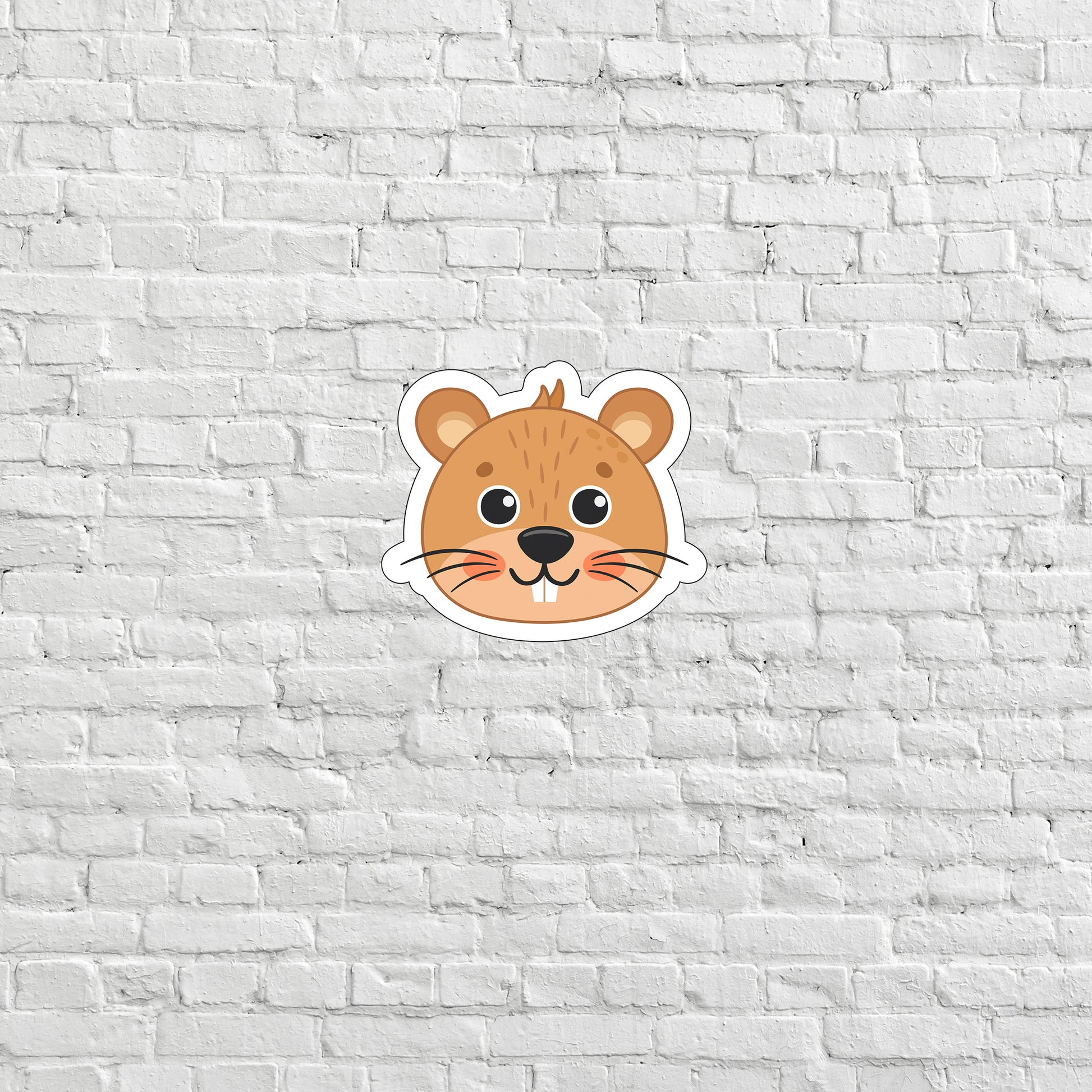 a sticker of a mouse on a white brick wall