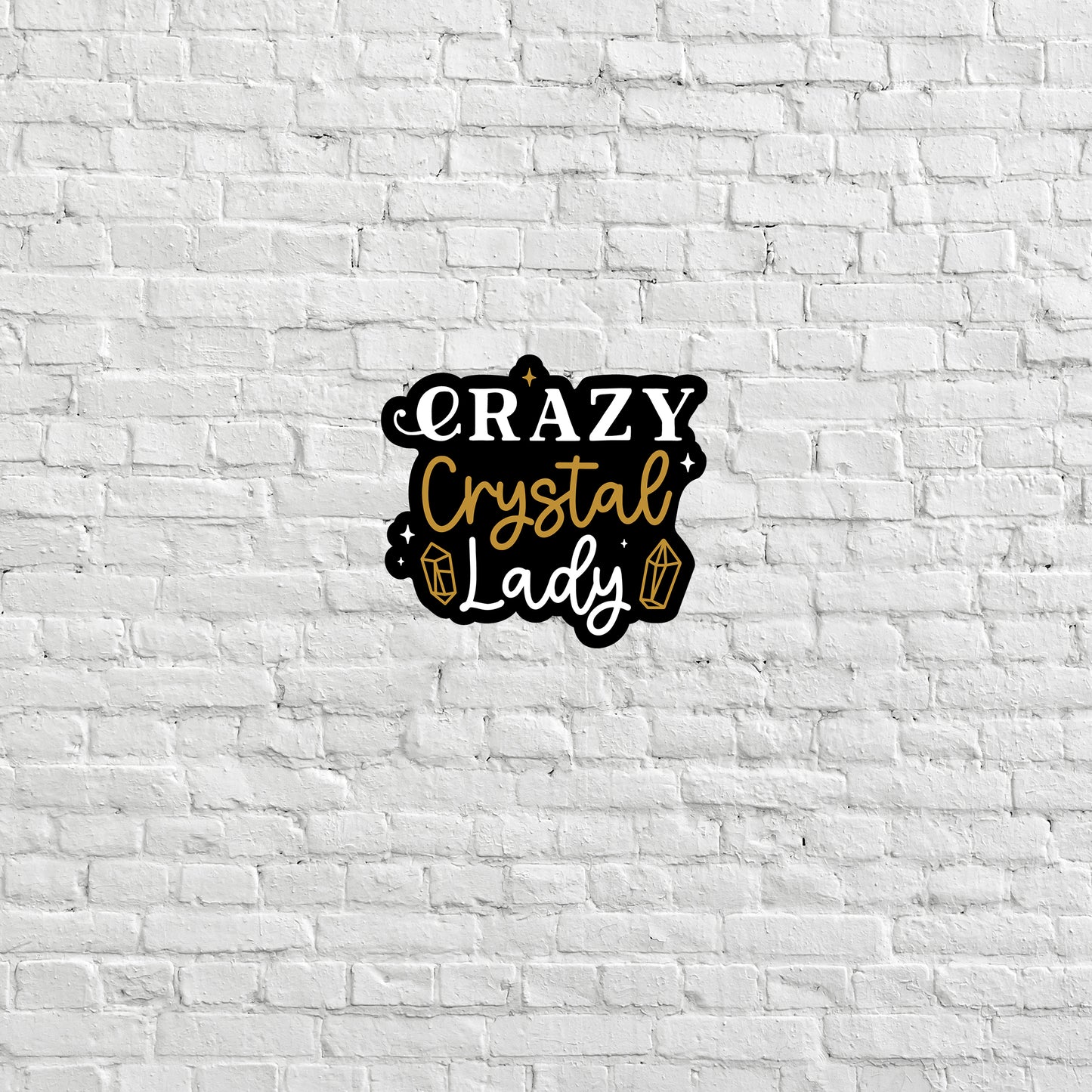 a white brick wall with the words crazy crystal lady on it